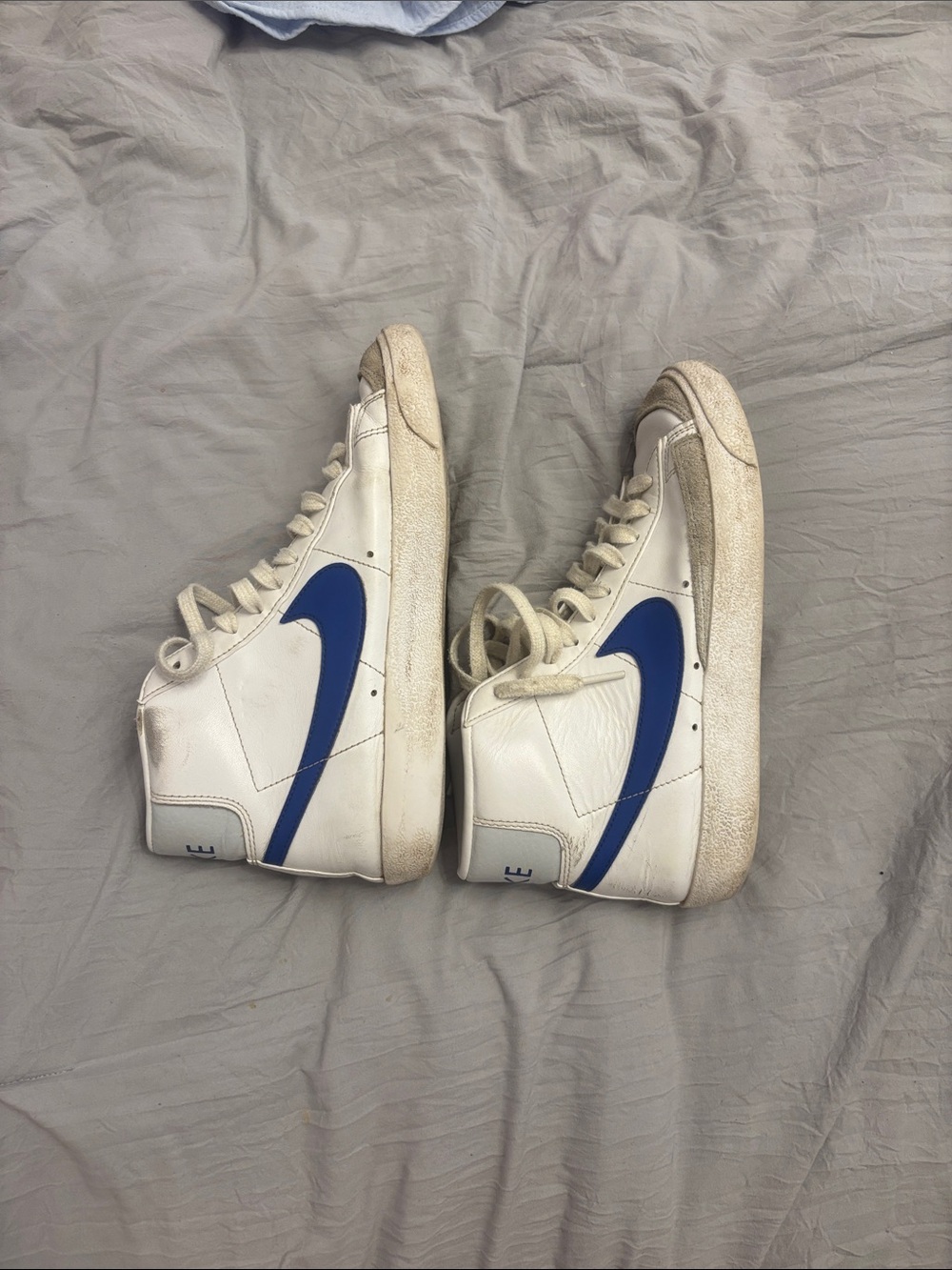 Nike White High-Top Sneakers with Blue Swoosh